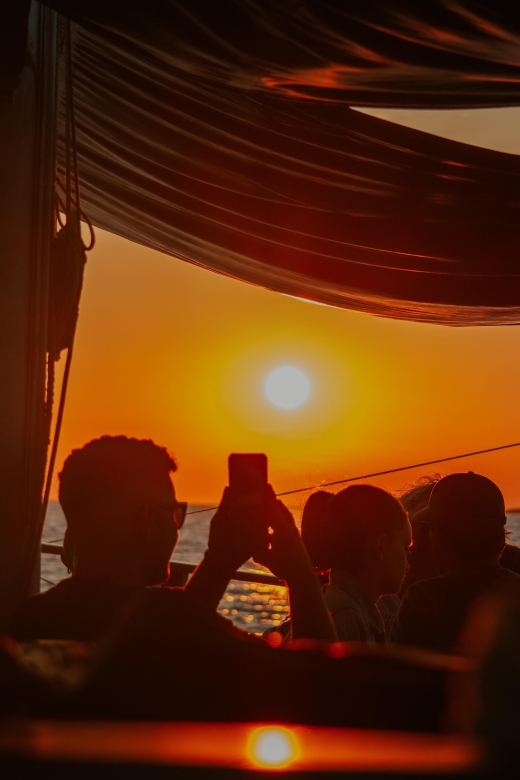 Argostoli: Sunset Cruise with Swim Stops, Dinner, and Wine - Leaving Argostoli harbor in the early evening