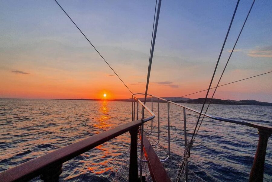 Argostoli: Sunset Cruise with Swim Stops, Dinner, and Wine - Sunset views from the Kefalonian coast