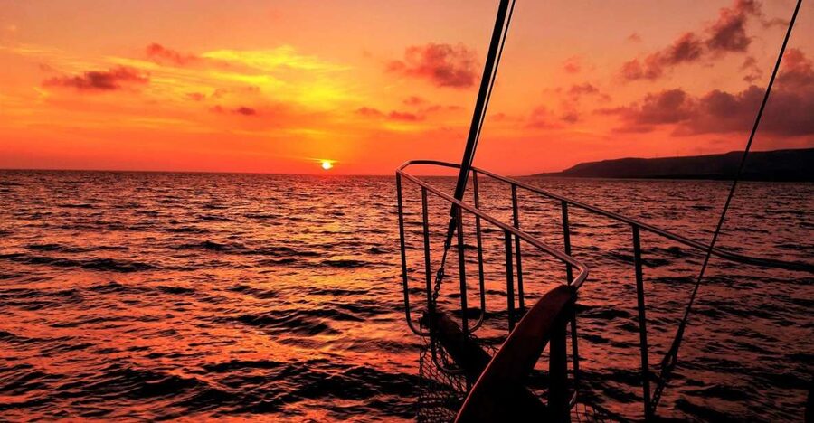 Argostoli: Sunset Cruise with Swim Stops, Dinner, and Wine - What the crew adds to the experience
