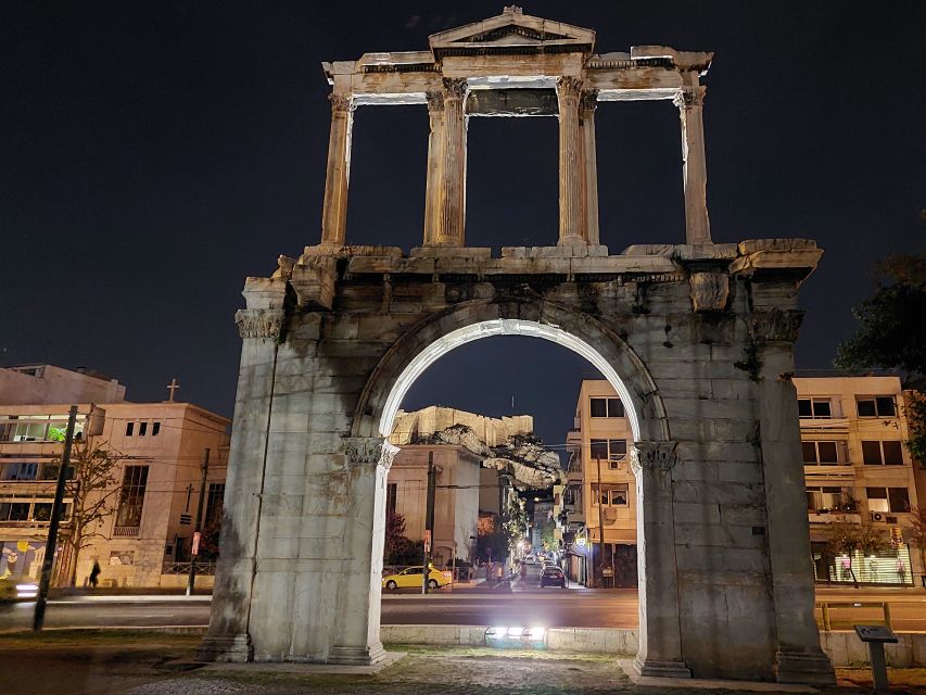 Athens: City Highlights Nighttime Walking Tour in Spanish - Meeting under the National Library sculpture