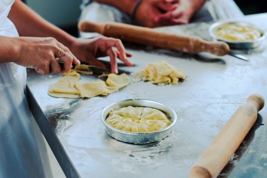 Athens: Greek Cooking Class & Dinner on a Rooftop - Folding spinach pie and other traditional pies