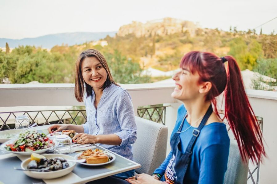 Athens: Greek Cuisine Cooking Class and 3-Course Dinner - Sitting down to eat at Hill Athens