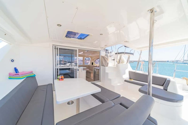 Athens: Half-Day Sunset Catamaran Cruise with Meal & Drinks - Greek meze, seafood pasta, and drinks on deck