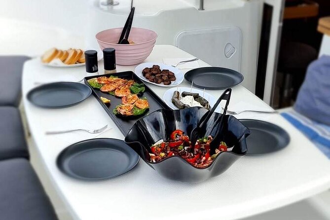 Catamaran Day & Sunset Cruises with meals Drinks and transportation - Passing Baos and viewing Delos from the sea