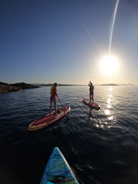 Chania: Stand-up Paddleboard Coastal Sunset Experience - A golden-hour view of Chania from the sea