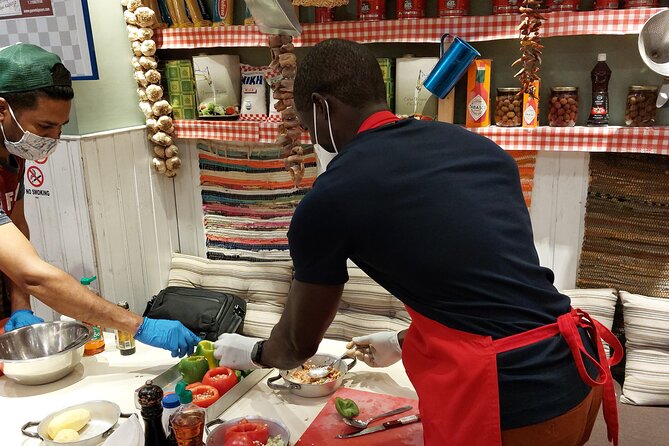 Cooking Class in Athens with Shopping in Central Market & Lunch - Sitting down to lunch