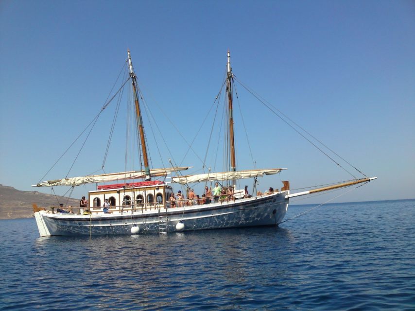 Corfu Town: Full-Day Cruise with Lunch, Drinks & Swim Stops - Leaving Corfu Town beneath the Old Fortress