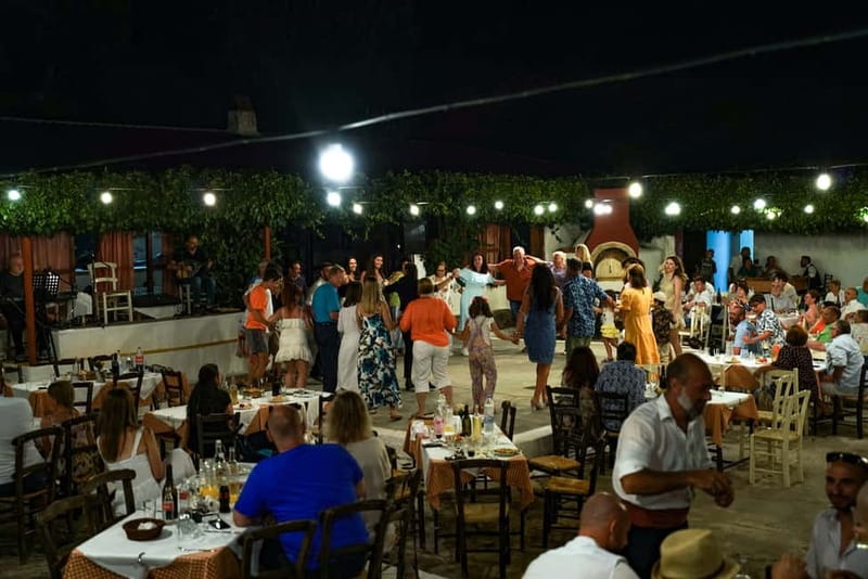 Cretan Night: Dinner & Live Show at Pano Karouzanos Village - Dinner with local wine and Cretan hospitality