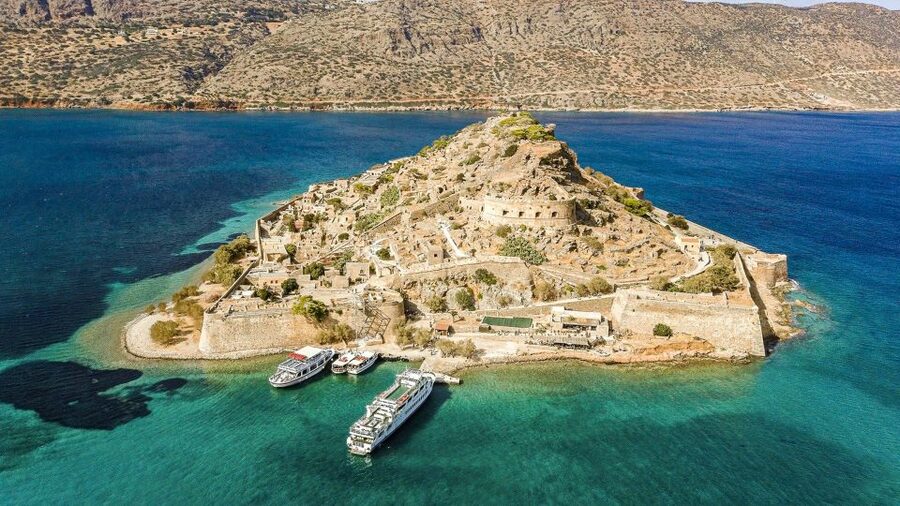 Crete: Day Trip to Agios Nikolaos and Spinalonga Island - Coaches, pickup, guides, and the long return