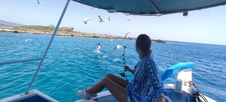 Crete: Fishing & Swimming Boat Cruise with Lunch & Drinks - Setting out from Elounda and passing Spinalonga