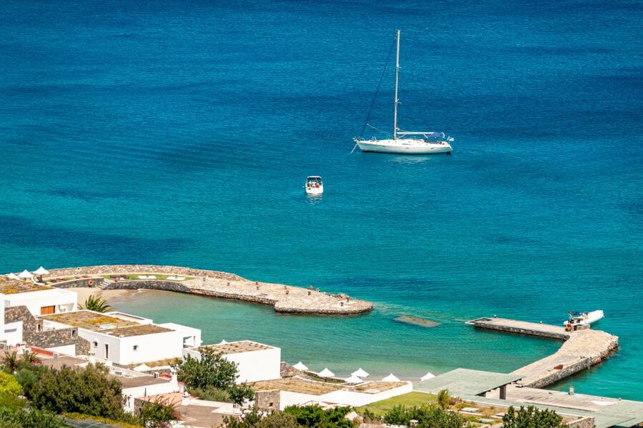 Elounda: Spinalonga Guided Boat Tour with BBQ and Swimming - Leaving Elounda across Mirabello Bay