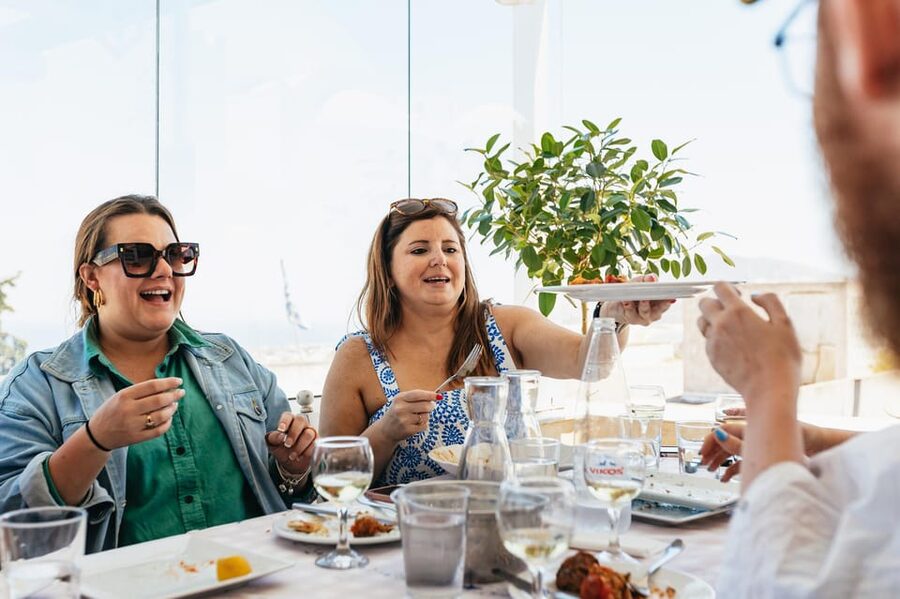 Fira: Guided Foodie Walking Tour with Tastings - The main tavern meal with a caldera view