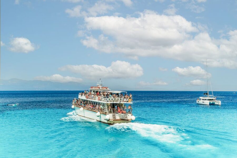 From Corfu Island: Antipaxos & Paxos Blue Caves Boat Cruise - Entering the Blue Caves along Paxos’s west coast