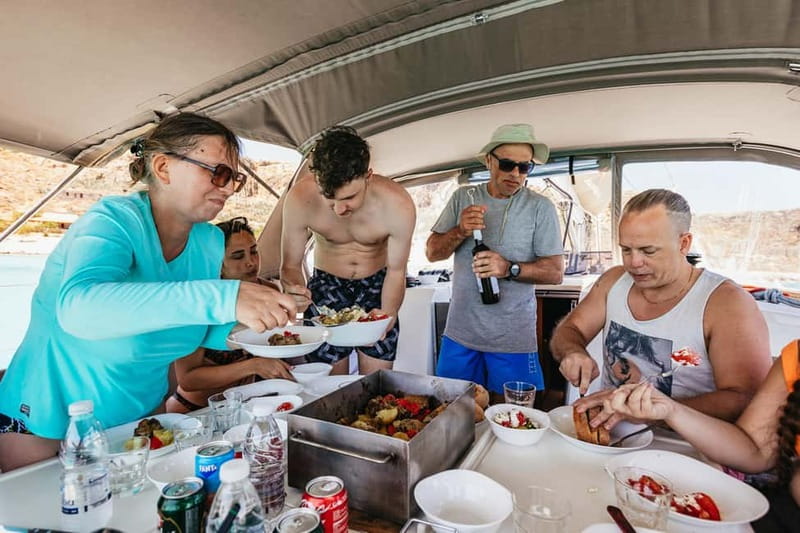 From Kissamos: Balos Gramvousa Sailing Cruise with Lunch - The crew shapes the day
