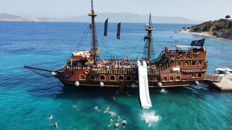 From Kos: 3-Island Pirate Cruise with Lunch and Waterslide - Plati Island: the main event for swimming and the waterslide