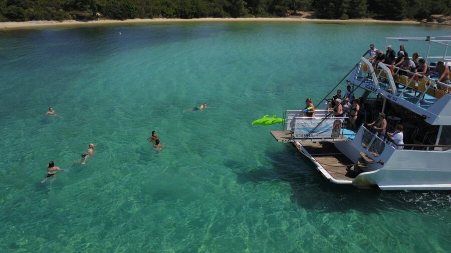 From Ouranoupoli: Blue Lagoon Two Island Cruise - Banana Beach combines lunch, music, and sea time