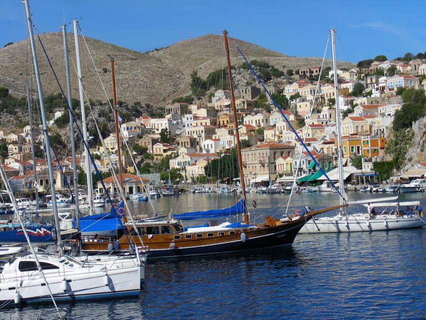 From Rhodes: Boat Trip to Symi Island with Hotel Transfer - What the guide adds to the day
