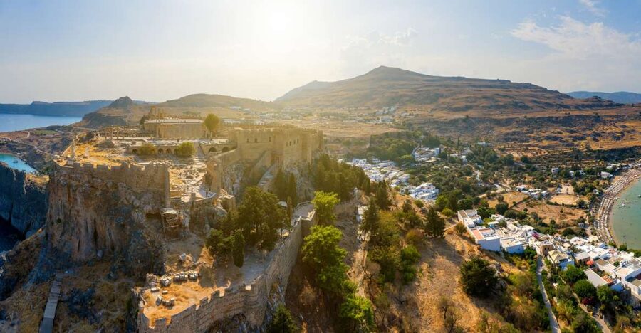 From Rhodes: Lindos Village and Acropolis Guided Tour - Walking through the whitewashed village