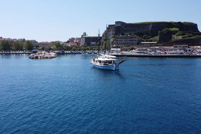 Full Day Cruise from Corfu in Classic Wooden Vessel, Swim & BBQ - Peristeres Lighthouse from the water