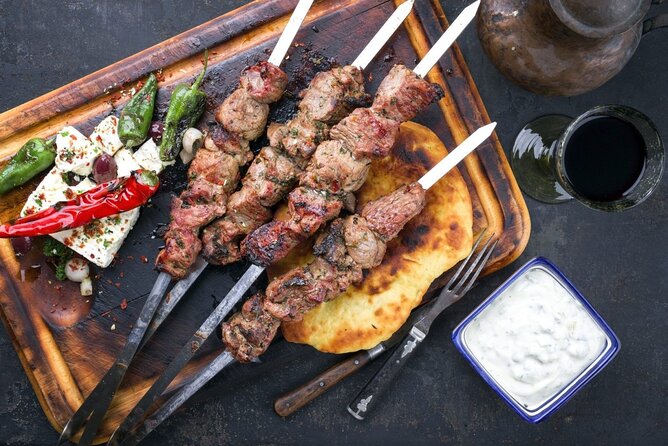 Greek Cuisine Cooking Class in Santorini with Recipes and Wine - Timing, transport, and booking details