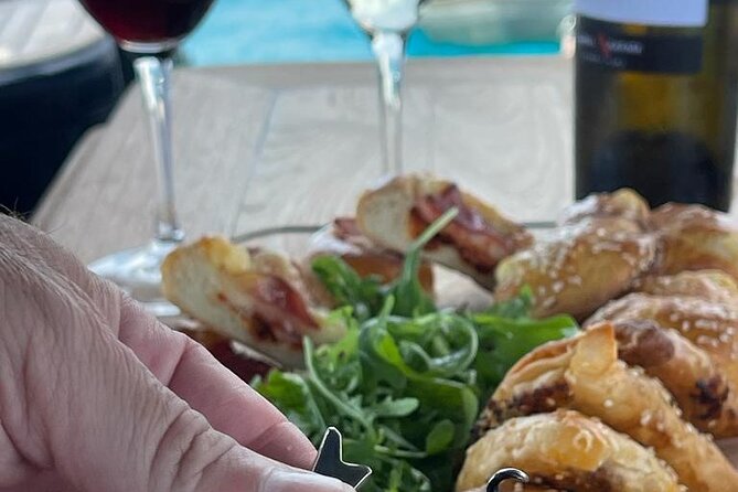 Greek Gastronomy & Wine Pairing Cruise with a Sommelier in Athens - A relaxed boat, not a luxury yacht fantasy