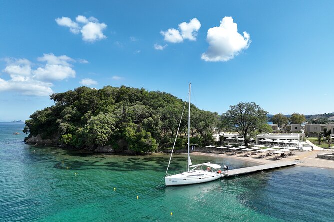 Half Day Cruise on a Sailing Yacht in Corfu Island - Clear water, snorkeling gear, and the onboard SUP