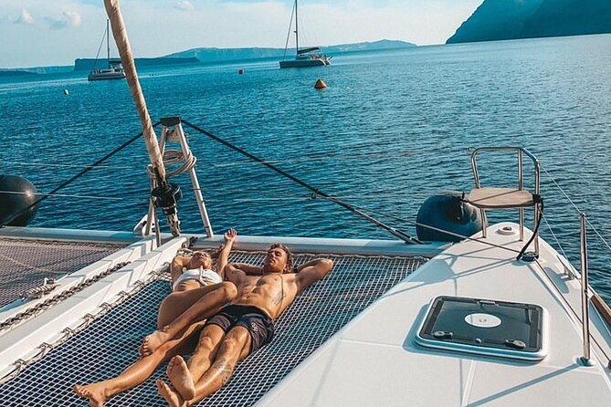 Half Day Premium Catamaran Cruise in Santorini including Oia - Limestone formations and clear water