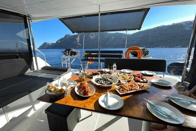 Half Day Premium Catamaran Cruise in Santorini including Oia - Red Beach: striking cliffs and a short first swim
