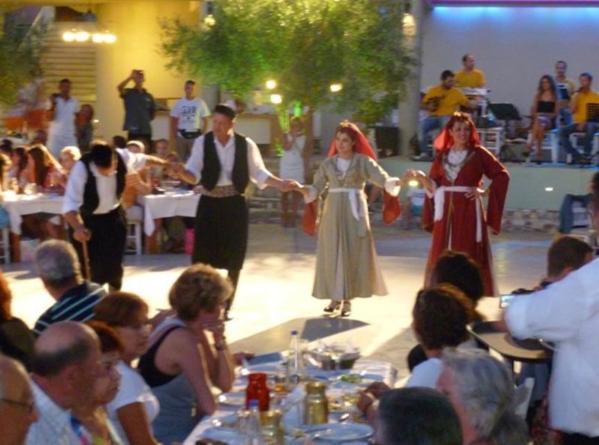 Kos: Tavern Dinner Experience with Greek Dancing and Wine - A mountain taverna with a busy shared-table setup