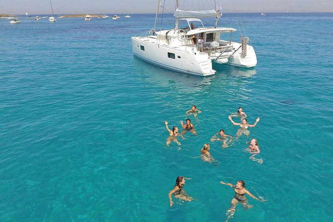 Luxury Catamaran Cruise from Athens with Traditional Greek Meal and BBQ - The first swimming stop, towels and clear water