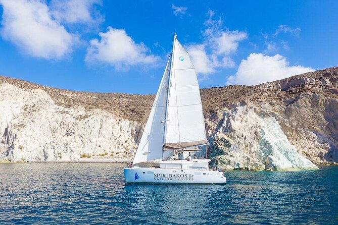 Luxury Small-Group Catamaran Cruise with BBQ, Open bar & Transfer - Thirasia and the caldera from sea level