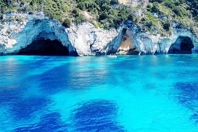 Paxoi, Antipaxoi and Blue Caves Cruise from Corfu - Entering the Blue Caves by boat