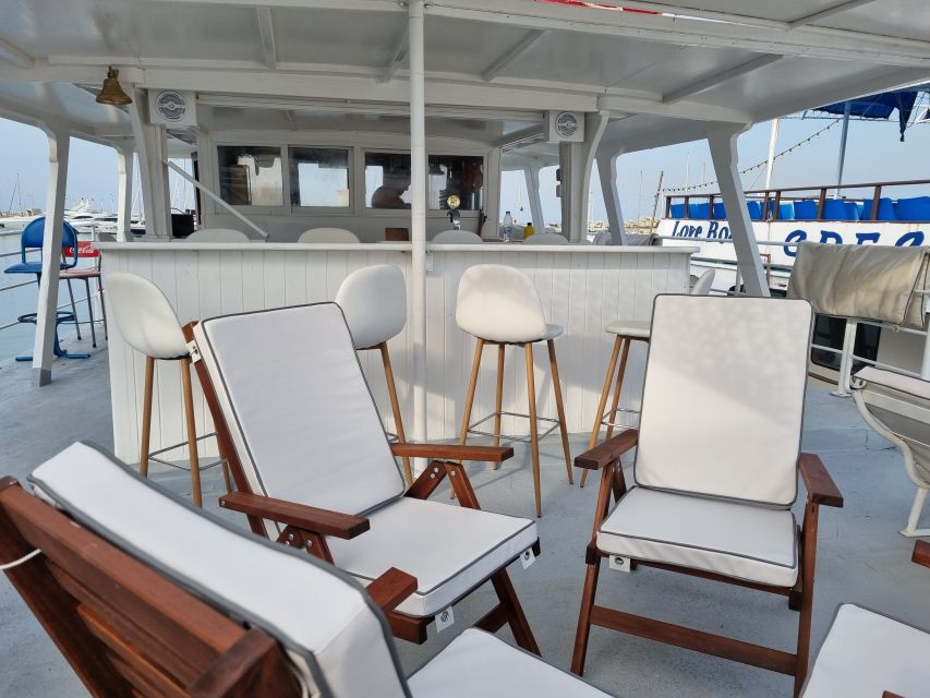 Rhodes: Bay to Bay Swim Cruise with Greek Buffet and Wine - Afandou Beach, Traganou Caves, and lunch
