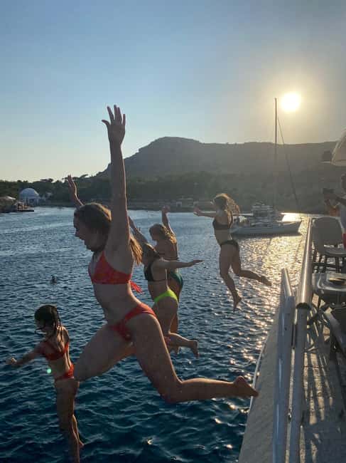 Rhodes: Sunset Cruise w/ Gourmet Buffet, Drinks & Live Music - Kalithea Bay: swim, snorkel, or stay dry