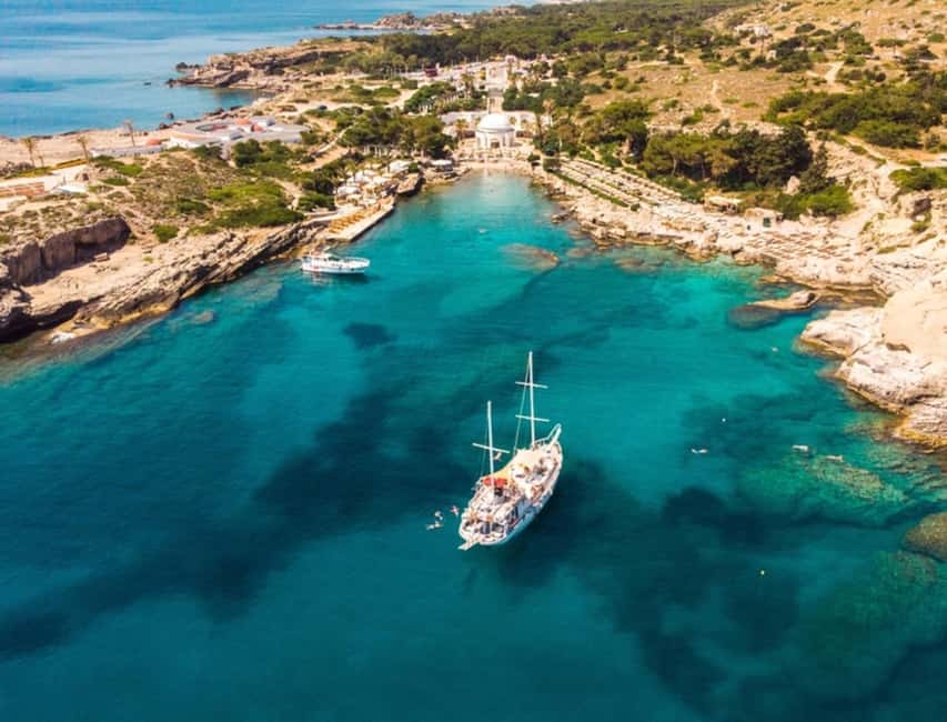 Rhodes: Sunset Cruise w/ Gourmet Buffet, Drinks & Live Music - Leaving Mandraki Port with Rhodes in view