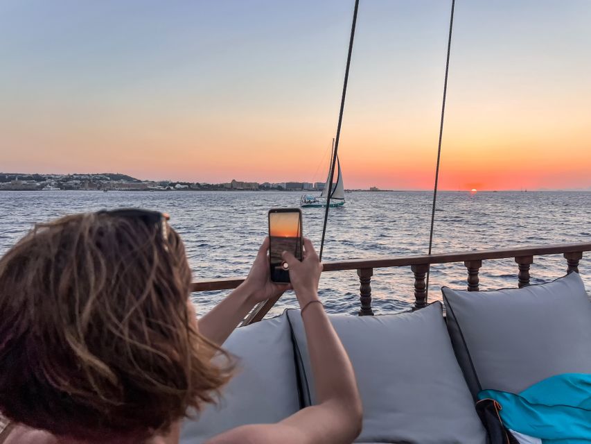 Rhodes: Sunset Cruise with Greek BBQ and Unlimited Drinks - The open bar and onboard atmosphere