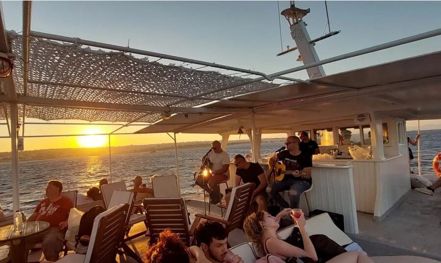 Rhodes: Sunset Cruise with Live Music, Wine & Greek Buffet - Sailing past Rhodes landmarks