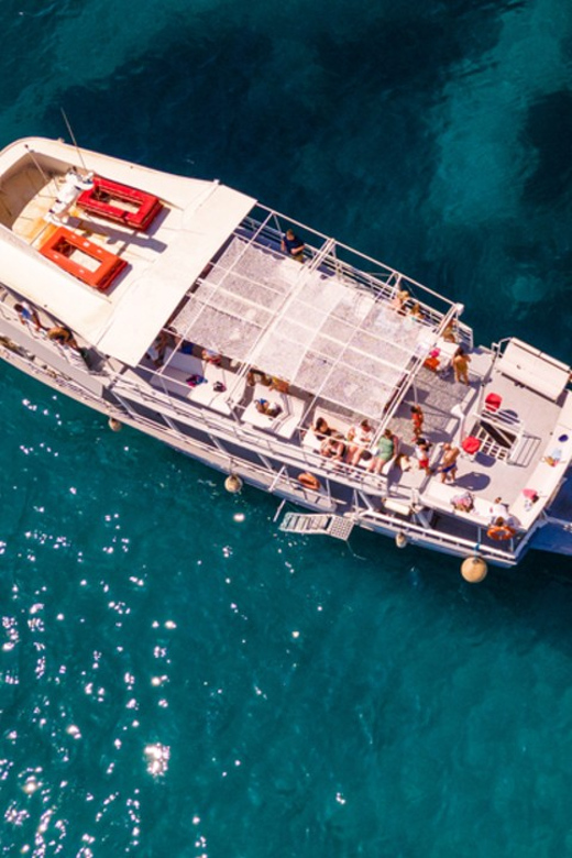 Rhodes: Sunset Cruise with Live Music, Wine & Greek Buffet - The Kallithea Springs swim stop