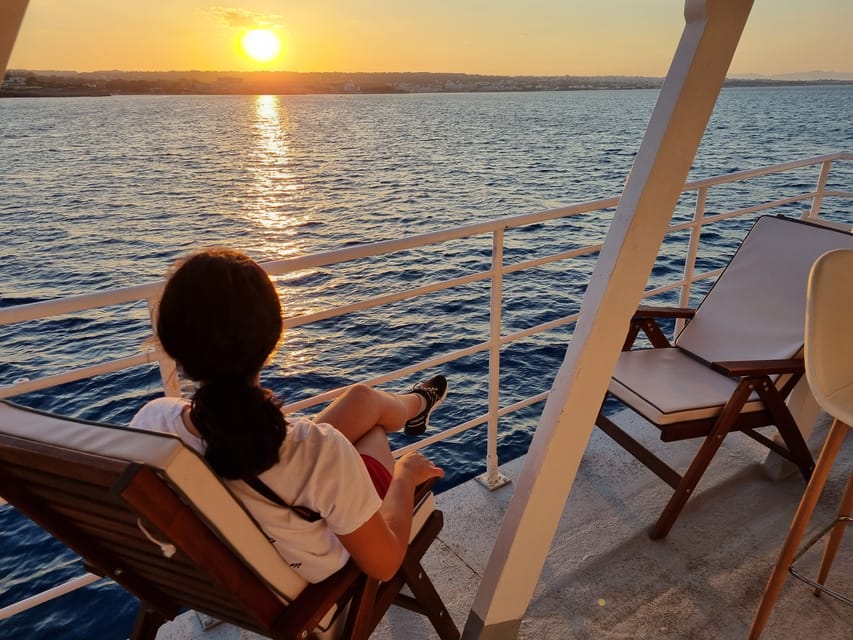 Rhodes: Sunset Cruise with Live Music, Wine & Greek Buffet - Sunset and live guitar on the return