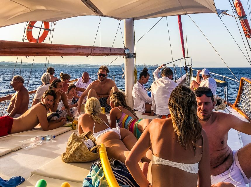 Rhodes Town: Sunset Boat Cruise with Drinks & Snacks - From Mandraki Marina to open water
