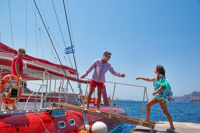 Sailing Catamaran Cruise in Santorini with BBQ, Drinks and Transfer - White Beach, BBQ, and the Longest Stop