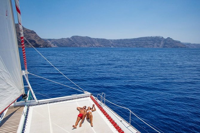 Sailing Catamaran Cruise in Santorini with BBQ, Drinks and Transfer - Value at About $95.53 Per Person