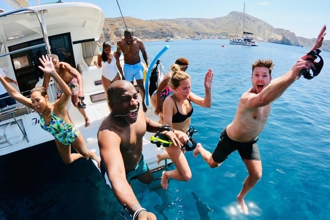 Santorini All-inclusive Catamaran Cruise with Thirassia Stop - Black Mountain, Indian Rock, and the Akrotiri lighthouse