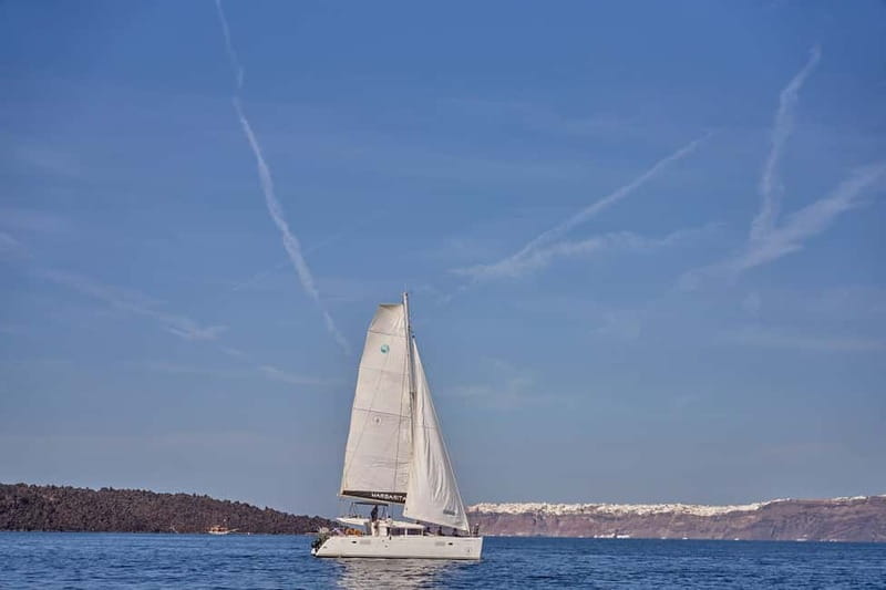 Santorini: Caldera Classic Catamaran Cruise w/ Meal & Drinks - Red Beach: scarlet cliffs and the first swim