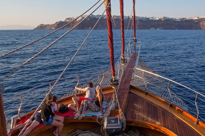 Santorini Caldera Sunset Sailing Cruise with Dinner and Wine - Sunset from the water near Oia