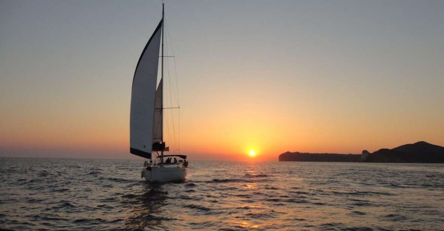 Santorini Caldera: Sunset Sailing Cruise with Meal - Red Beach and White Beach from offshore