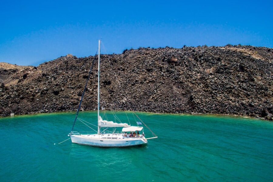 Santorini Caldera: Sunset Sailing Cruise with Meal - The sunset return toward Akrotiri