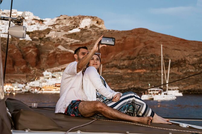 Santorini Catamaran Cruise with Greek Meal, Open-Bar and Sunset - Oia and Ammoudi Bay from below