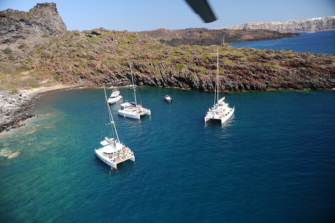 Santorini Classic Catamaran Cruise with BBQ, Drinks and Transfers - The volcano, lunch, and an open-water pause