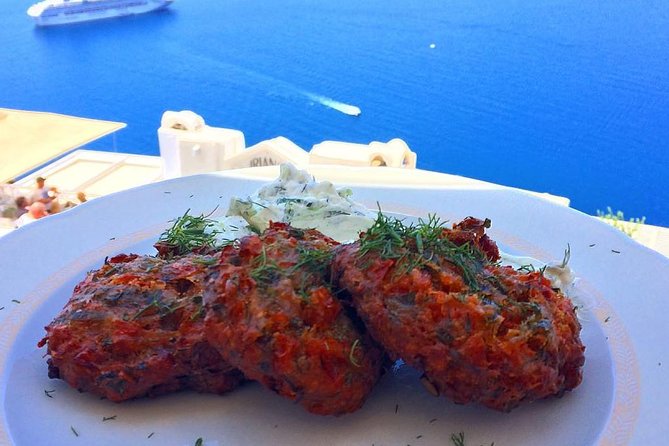 Santorini Food Tour: Fira Half-Day Small-Group Tour with Tastings - The tavern meal with a caldera view